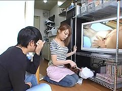 Japanese hottie watches porn and gets amazingly fucked