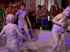 Hot bodied lesbos fighting in messy mud at a sex party