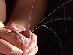 Kinky dude milks some Asian chick's tits dry on her body