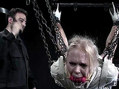 Blonde in straitjacket and gas mask gets humiliated