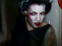 Two chicks with strange makeup get fucked in FFM video